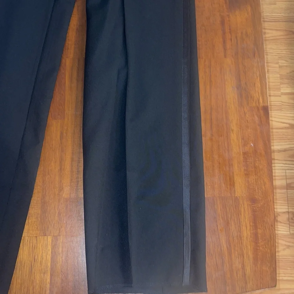 Formal Fashions men’s black tuxedo jacket and pants. Jacket 38S, Pants 34x34
